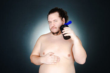 Fototapeta premium Funny fat man on a diet.