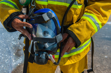 Firefighters practice building fire response plans using foam.