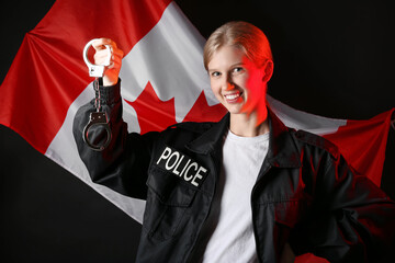 Female police officer with handcuffs and flag of Canada on dark background