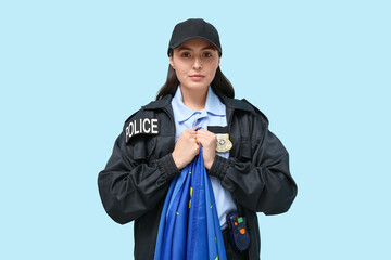 Female police officer with flag of EU on blue background