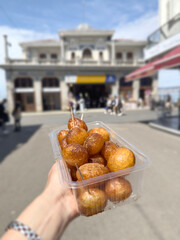 traditional fried donuts dessert with syrup and cinnamon known as lokma in Turkish.