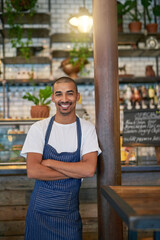 Cafe, man and business or happy portrait, entrepreneur and crossed arms and proud for startup. Coffee shop, restaurant or smile with owner for hospitality service, workplace for profession and work