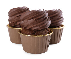 Three delicious chocolate cupcakes isolated on white