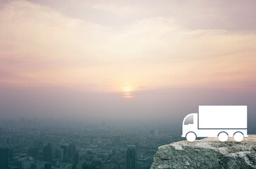 Truck icon on rock mountain over aerial view of cityscape at sunset, vintage style, Business transportation service concept