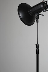 Photo Studio Equipment. Beauty Dish Modifier on White Cyclorama. Fashion Shoot Light.