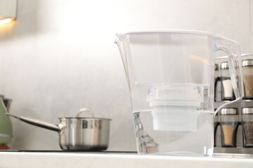 Water filter jug on countertop in kitchen