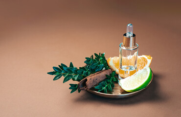 Aromatherapy and perfumery background, adorned with cinnamon sticks, lime, orange and the finest...