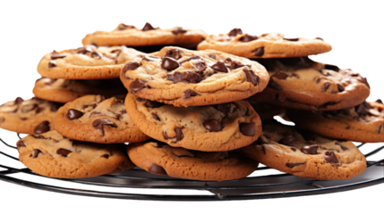 A tower of freshly baked chocolate chip cookies sits on a shiny cooling rack
