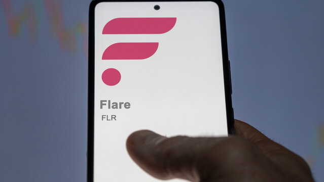 Close up on logo of (FLR) Flare on the screen of an exchange. (FLR) Flare price stocks, $FLR on a device.