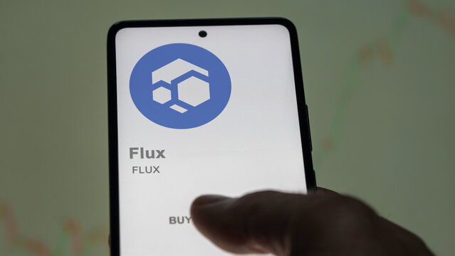 Close up on logo of (FLUX) Flux on the screen of an exchange. (FLUX) Flux price stocks, $FLUX on a device.