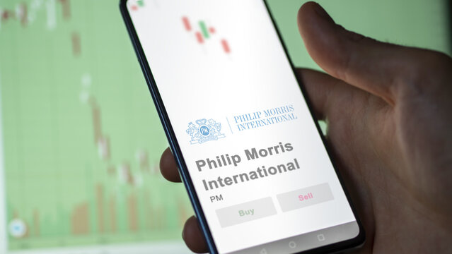 April 09th 2024 , New York City, New York. Close up on logo of Philip Morris International on the screen of an exchange. Philip Morris International price stocks, $PM on a device.