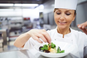 Cooking, food and chef in restaurant with dish presentation for lunch, fine dining and dinner....