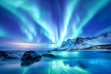 Naklejka premium Aurora borealis on the Lofoten islands, Norway, Night sky with polar lights, Night winter landscape with aurora and reflection on the water surface
