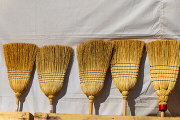 bunch of brooms with red and blue stripes