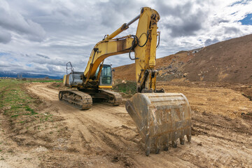 Excavator building a road in a site construction