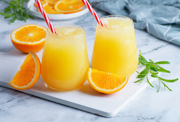 Glass of orange juice with ice. Cold orange fresh. Glass of orange juice