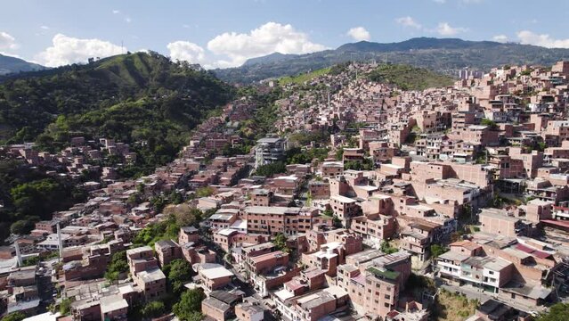 Comuna 13 favela with Metrocable, Medellin Colombia - aerial flyover