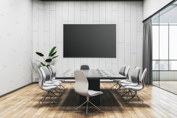 Modern meeting room interior with furniture and empty black mock up banner on wall. 3D Rendering.