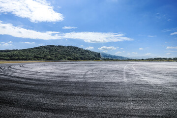 Asphalt square road and mountains background