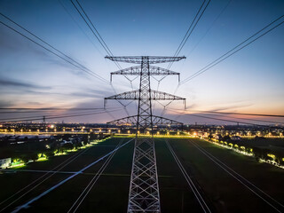 High voltage electricity tower landscape at sunset
