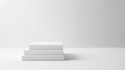 Three blank white books stacked on a clean white background, representing simplicity and minimalism
