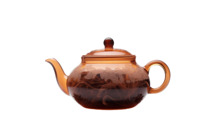 A glass teapot with a brown lid sits elegantly on a table