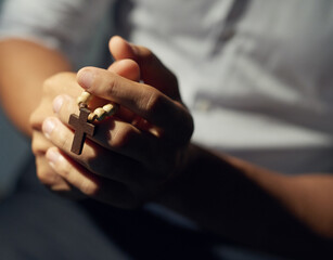 Hands, praying and worship of person with rosary for faith, spiritual healing and sermon at church. Love, God and support in religion with praise to Jesus for grace, peace and christian gratitude