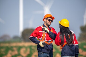 couple engineer team inspection check control wind power machine construction installation in wind energy factory. Two technician professional worker discussion for maintenance wind power turbine
