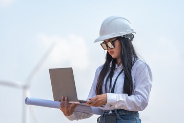 Woman engineer inspection check control wind power machine construction installation in wind energy...