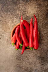 Red and hot Chili pepper on vintage stone  background