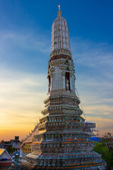 Small Prang, the side tower of the Wat Arun (Temple of Dawn) at Bangkok, Thailand. Wind god Vayu on...
