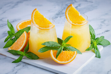 Glass of orange juice with ice. Cold orange fresh. Glass of orange juice for hot summer day