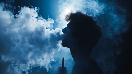 A young man is exhaling a cloud of smoke from his mouth