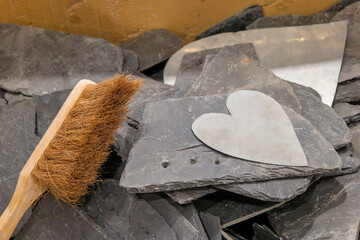 white heart on slate stones with a brush