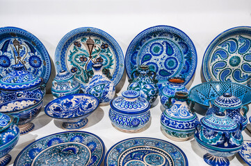 Uzbek handmade ceramic plates and tableware with hand-painted traditional Asian blue patterns at...