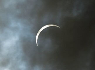 the  total solar eclipse of april 9, 2024, as seen  through the clouds from hugo lake state park,...