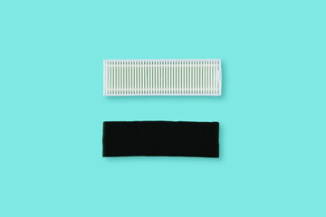 Hepa filter and carbon filter for robot vacuum cleaner. Green background.