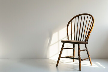 Simple yet elegant Windsor chair positioned on a solid white background.
