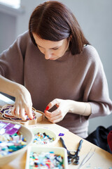 The process of creating a flower from a mosaic. 