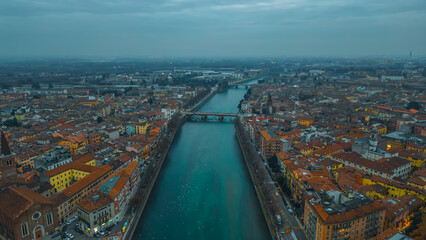 Aerial view of beautiful of Verona and Adige river, Veneto region, Italia. Red tiled roofs....