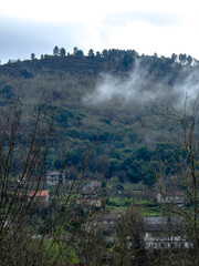Fog Whispering Through a Mountain Village