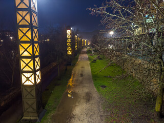 Illuminated Pathway in Park at Night