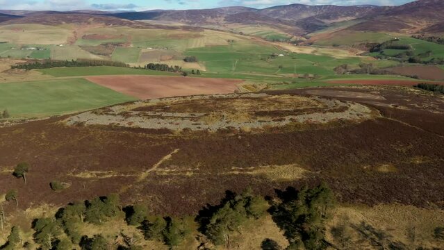 White Caterthun prehistoric hillfort, Brechin, Scotland. Possibly Pictish, on earlier Bronze or Iron Age occupation site. Aerial video looking NW