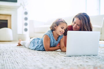 Mother, girl and laptop for learning in home, online class and remote homeschool or education on...