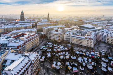 The aerial cityscape of Christmas markets in Dresden covered in snow on a cold winter day in late...