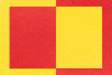 Texture of red and yellow paper background with geometric shape and pattern, macro. Craft cardboard