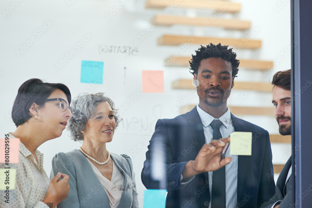 Poster People, brainstorming and sticky notes on glass for project, teamwork and strategy in office with diversity. Event managers, planning and meeting with moodboard for business, collaboration and idea