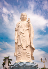 Giant Buddha statue in Vietnam with blue sky