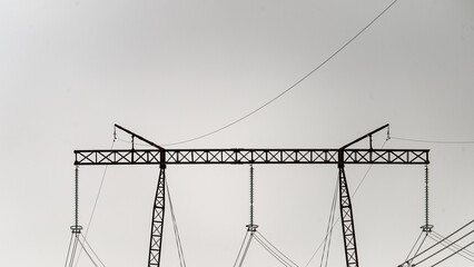 550 kilovolt power line close-up. Transmission of electricity by overhead power lines of increased...
