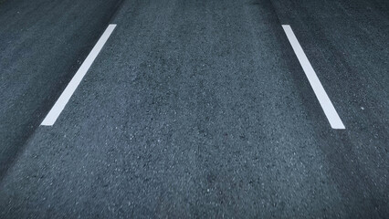 The new asphalt glistens like obsidian, a ribbon of promise stretching into the horizon. A car...